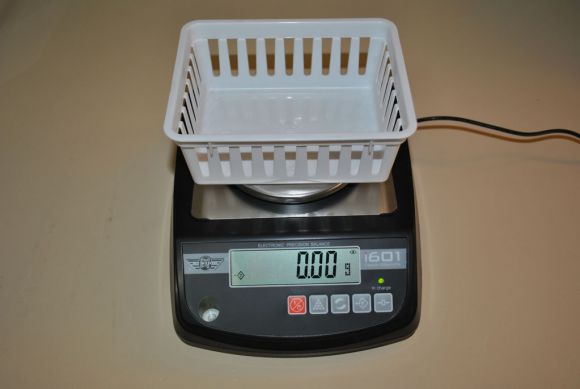 Scale with a basket on top after taring